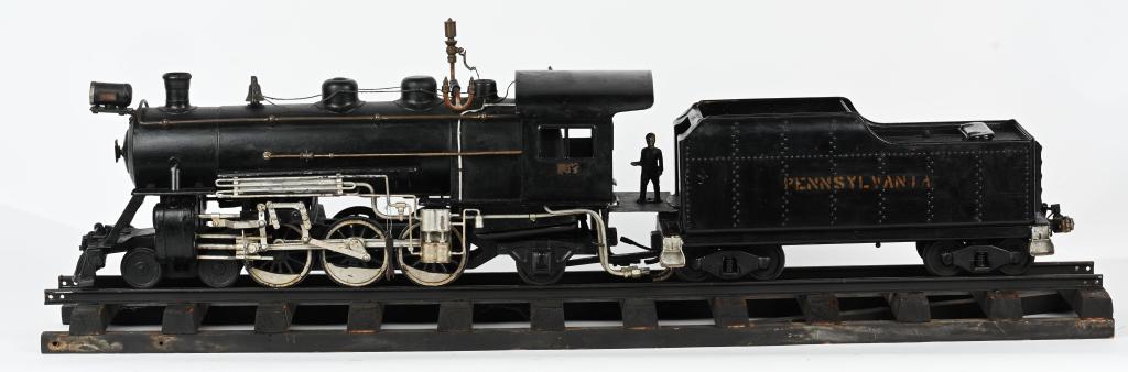 STEAM DRIVEN BUDDY L LOCOMOTIVE & TENDER: Custom period built Steam Driven Buddy L Locomotive and Tender. A very well done custom done to add steam power. The toy has many custom tubes and pipes for the steam drive. A steam whistle has been a