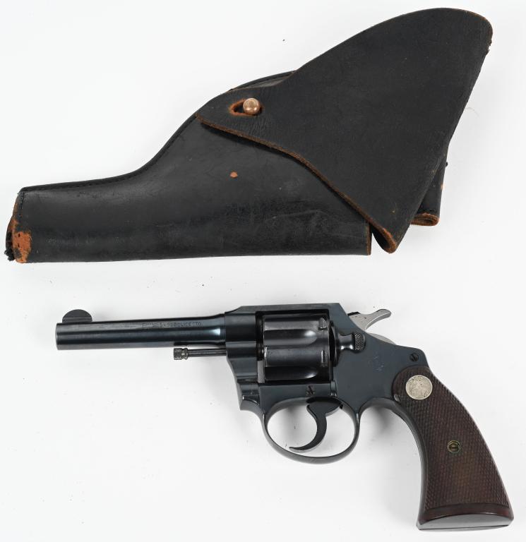 COLT POLICE POSITIVE REVOLVER: SERIAL 360676. BARREL 4". CALIBER 32. MADE 1928. Standard blue finish, six shot, double action, silver medallion checkered walnut grips, fixed sights. Condition. Near mint gun, 98% blue, few scattered