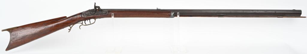PERCUSSION HALF STOCK. 38 RIFLE: SERIAL NA. BARREL 37 1/2", .38 CALIBER. Stained maple stock with brass hardware and pewter nose cap. Octagon barrel has rib underneath. Lock looks to be a Golcher style English lock. CONDITION Action