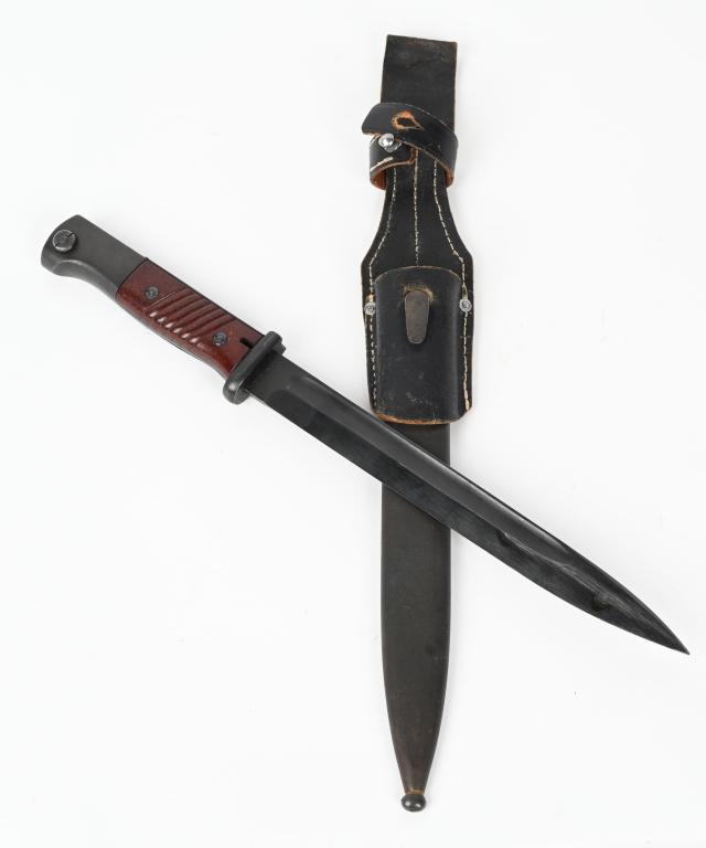 WWII NAZI GERMAN MAUSER K-98 BAYONET & SCABBARD: Blade has nice factory finish and is marked 44 CRS. There are Waffenamt on the pommel. The scabbard is marked COF 43. Includes original leather frog. 15 3/8" Excellent