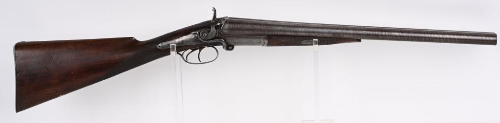 UNMARKED SIDE LEVER 10 BORE STAGE COACH SHOTGUN: BARRELS 19.5". GAUGE 10 BORE. Features raised rib Damascus barrels, bead front sight, side lifter, back lock action, straight grip checkered walnut stock, double triggers. Condition. Name removed from