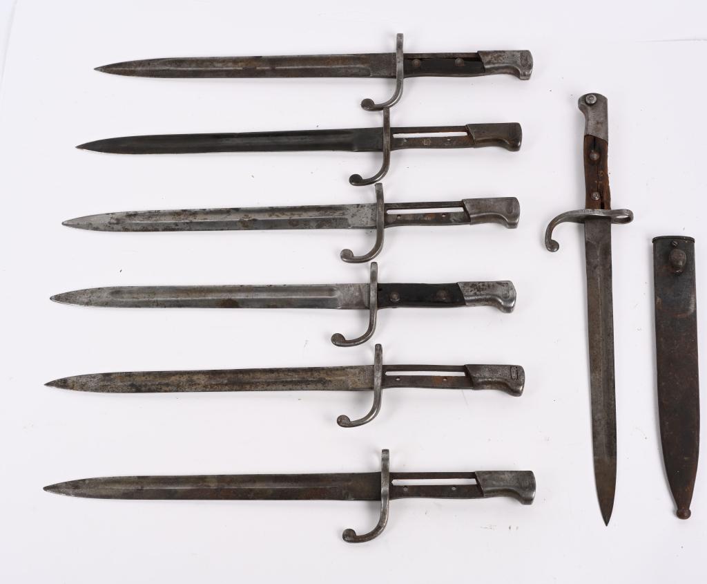 7 - GERMAN MODEL 1908 BAYONETS & MORE: Four of the bayonets are unmarked. The other 3 are Alex Coppel, W.K. , and Simson & Co. Also included is a metal scabbard for another model bayonet. 16 1/2". AS-IS