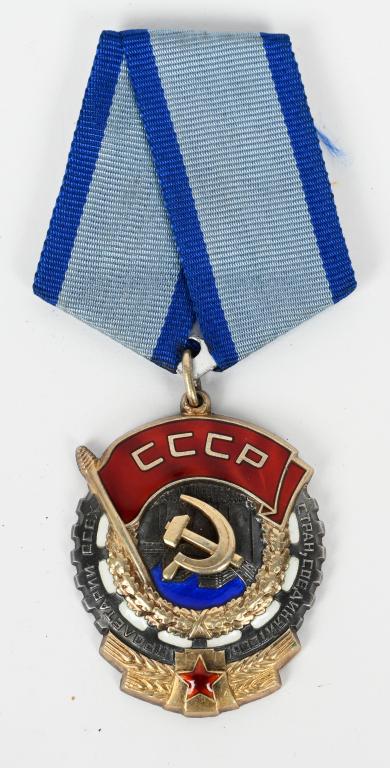 SOVIET UNION ORDER OF THE RED BANNER OF LABOR #ed: Order of the red banner of labor, #989772. Silver gilt, enamels; 47.5 mm tall (inc. the eyelet), 36.7 mm wide. Riveted three-piece construction; the serial number is engraved with a rotating tool.