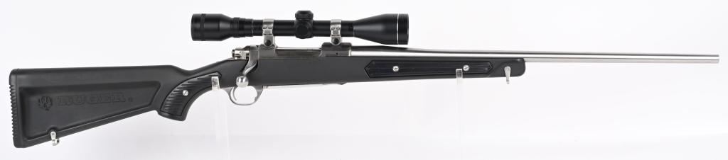 RUGER M77 MARK II STAINLESS WITH PADDLE STOCK: SERIAL NUMBER: 780-55415. BARREL: 22". CALIBER: .223 REM. MANUFACTURED: 1991. Standard optics ready gun with Ruger factory stainless rings attached to the receiver. Scope in the rings is a Tasco Prong