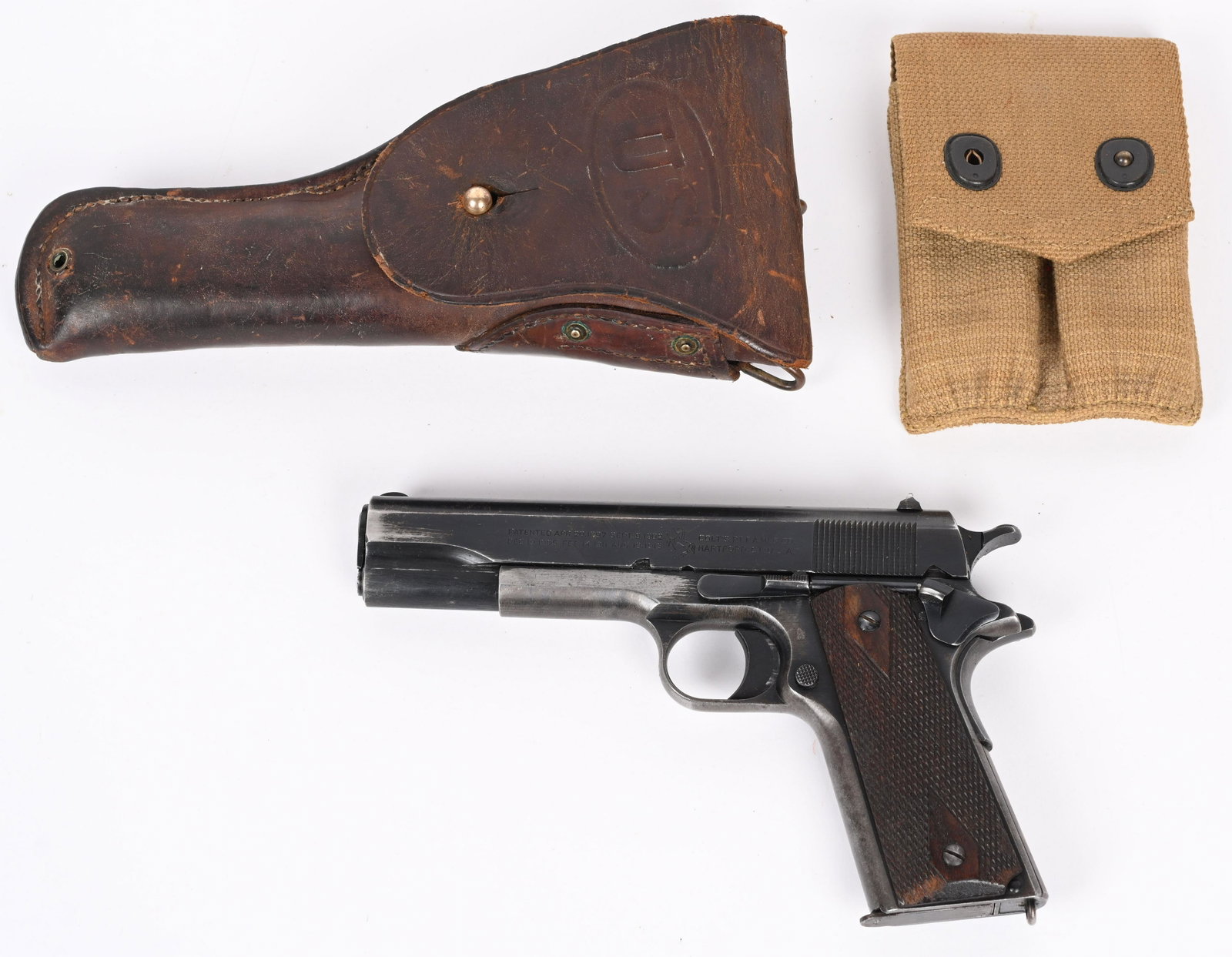 US ARMY COLT MODEL 1911 SEMI AUTO PISTOL: SERIAL 383451. BARREL 5". CALIBER .45ACP. MADE IN 1918. Standard features for the period to include war time blue finish, long smooth trigger, diamond checkered walnut grips., proper HP stamped barrel