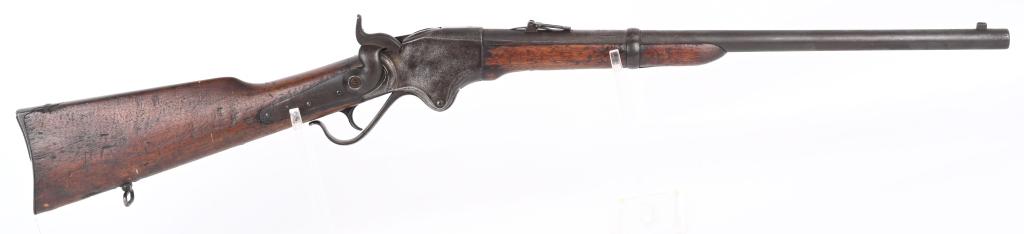 1860 SPENCER CARBINE: SERIAL 38785. BARREL 22". CALIBER 56-56. Standard Civil War era carbine with round barrel, ladder rear sight, sling bar & ring, walnut stocks, loader in butt plate, single band, rear sling swivel on b