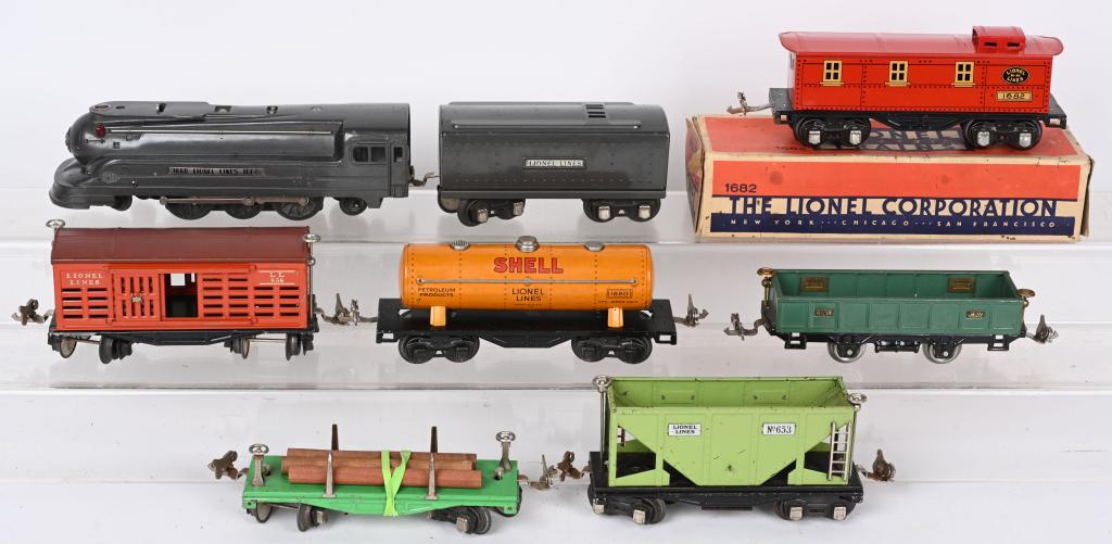 LIONEL 1668 LOCOMOTIVE, TENDER & 6 CARS: Includes 1668 Gun Metal Gary Locomotive, tender, and cars: 1682 boxed, 656, 1680, 902, 653 and 651. Very Good-Excellent