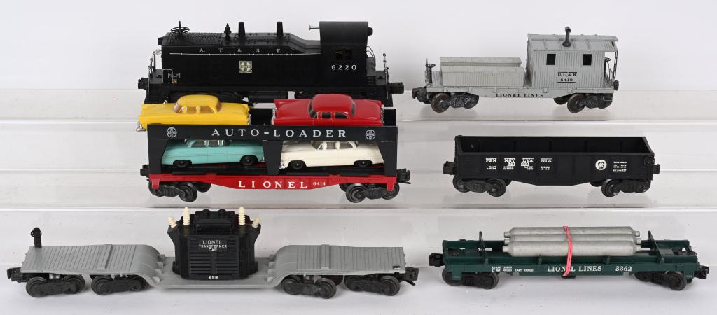 LIONEL 6220 AT&SF ENGINE & FRIEGHT CARS: Lionel #6220 AT&SF Switcher with #6518 Transformer Car, #2452 Gondola, #3362 Helium Car, #6414 Auto Loader Car, and #6419 Working Caboose. All in great original condition. Excellent