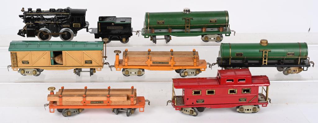 AMERICAN FLYER #1121 ENGINE w/ FREIGHT CARS: American Flyer #1121 Engine and Tender with 2-#3216 Lumber Car, #3012 Freight Car, #Green Freight Car, and #3014 Caboose. All original great condition. Excellent