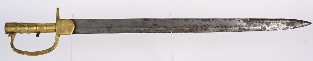 UNKNOWN SAPPERS BAYONET: A very unusual Sappers Bayonet measuring 25 3/4 overall with a 21 1/4 inch blade with a molded brass handle and a single languet crossguard.