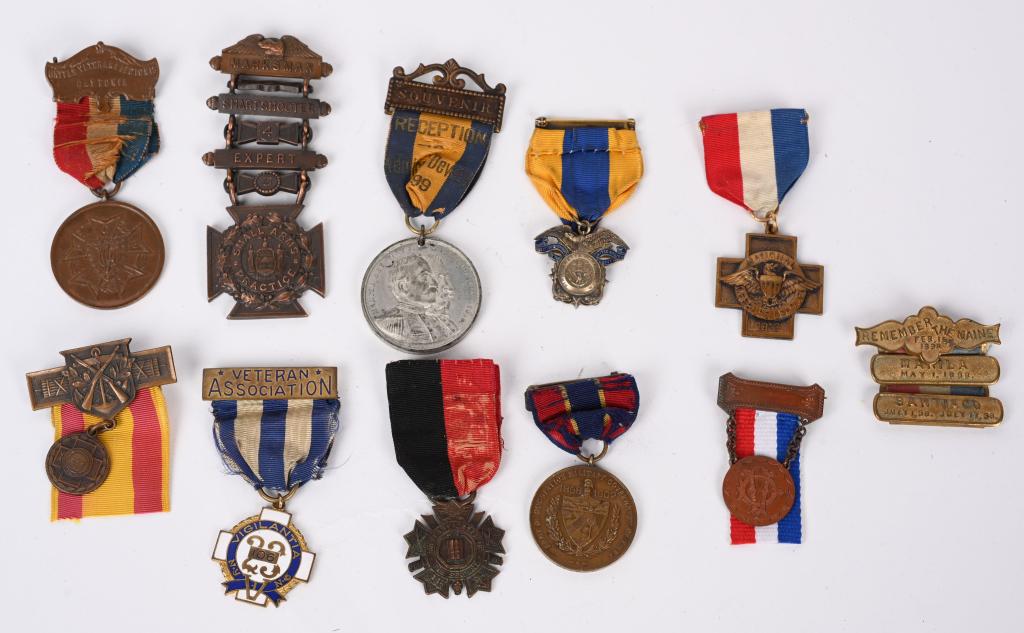 SPANISH AMERICAN WAR MEDAL LOT OCCUPATION CUBA: Spanish American War Medal lot to include 1) Marksmanship Medal by Tiffany 2) The Army of Cuban Occupation Medal No. 2846 3) 23rd NY Vigilantia Medal 4) Remember The Maine Ladder Badge 5) Union Vetera
