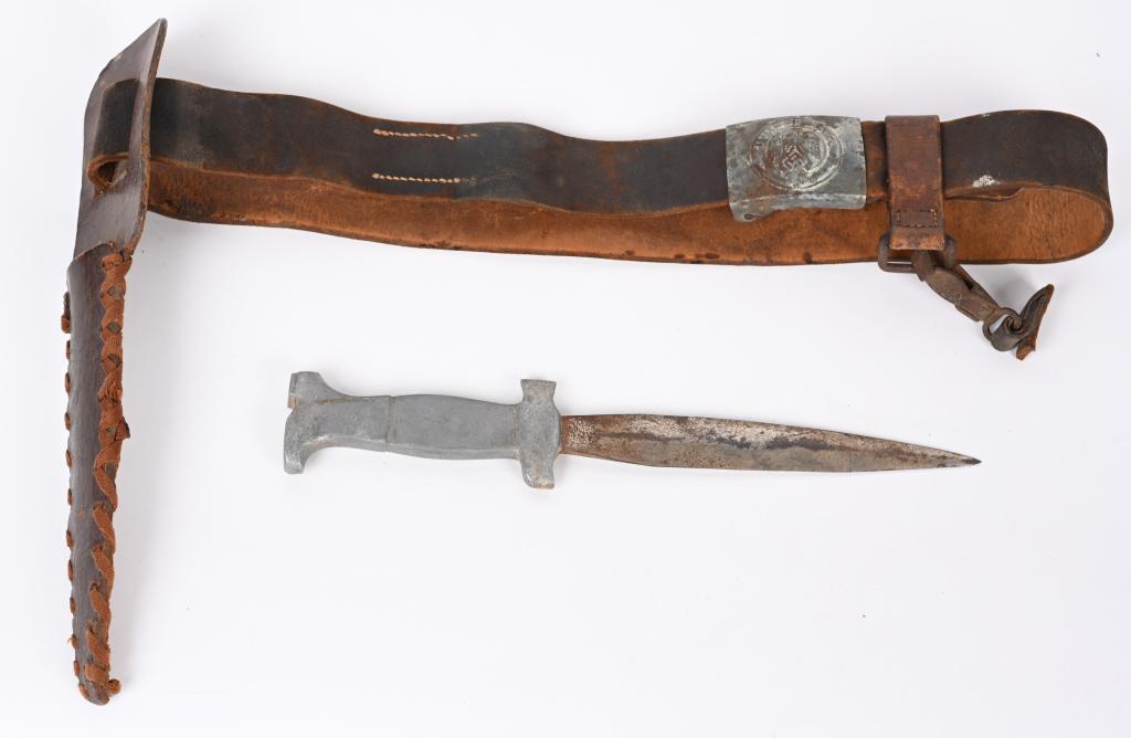 WWII NAZI GERMAN HITLER YOUTH BELT W THEATER KNIFE: A very attractive WWII Nazi German Hitler Youth belt and buckle with a very attractive Theater Made Dagger or Knife. The leather belt is 100cm and attached†to it is a typical steel constructed H