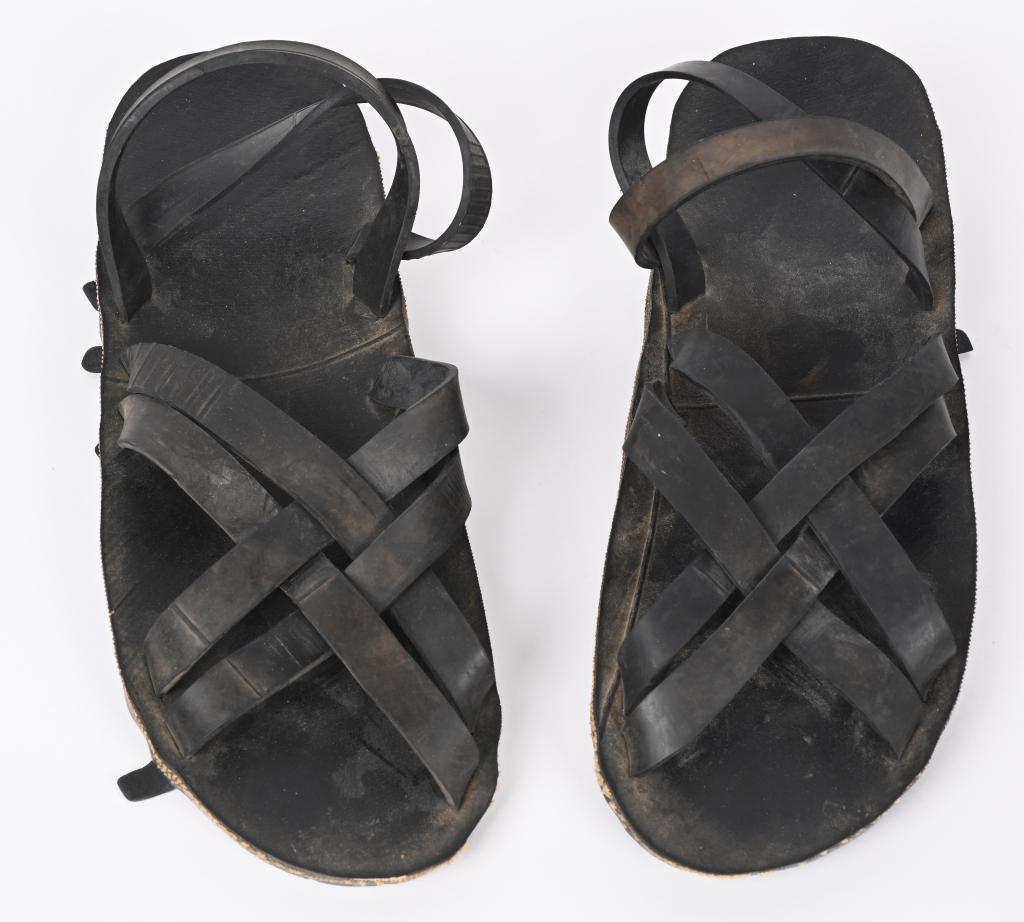VIETNAM WAR VIET CONG SET OF HO CHI MINH SANDALS: Vietnam set of Ho Chi Minh sandals measuring 11 inches long. The Ho Chi Minh sandals are a form of sandal made from discarded tires. Along with the khan r?n scarf, they were a distinctive clothing of