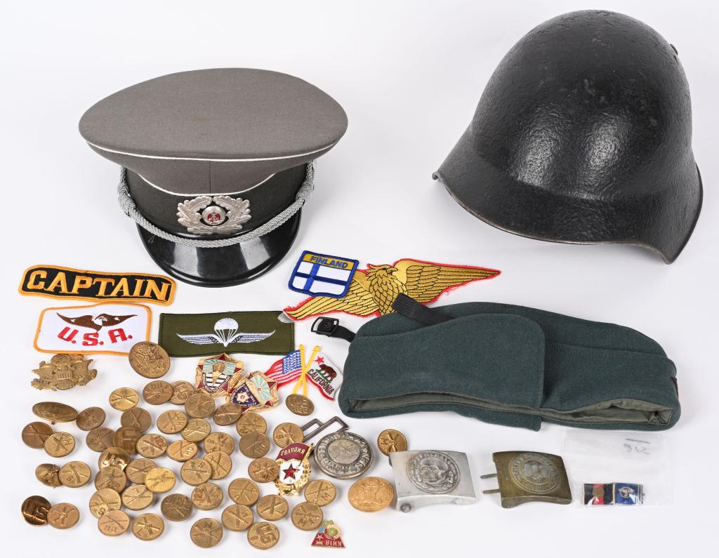 LOT OF MILITARY SWISS HELMET BAYONETS INSIGNIA: Mixed lot of militaria to include†1) Three reproduction German belt buckles 2) 1920's cap and collar insignia to include Infantry L disk, Cavalry L disk, Artillery M disk, Infantry Head Quarters