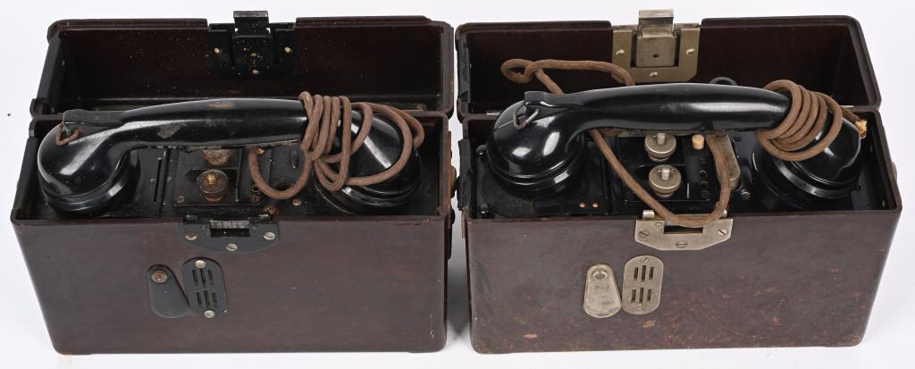 WWII NAZI GERMAN BAKELITE FIELD TELEPHONES (2) WW2: Two World War Two German Bakelite field telephones. The first phone is complete with hand crank. very good. The second phone is also in excellent condition but is missing the hand crank. Both have the
