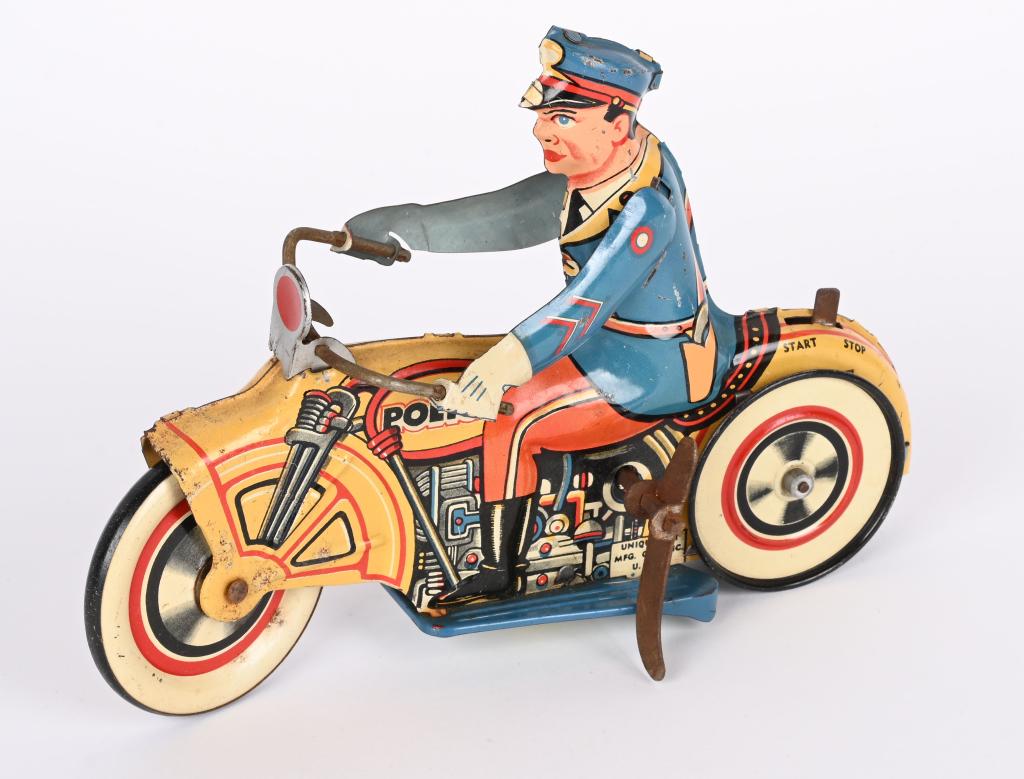 UNIQUE ART TIN WINDUP POLICE MOTORCYCLE: All original and complete. Windup works. Hard to find toy. 8 1/2" Very Good-Excellent