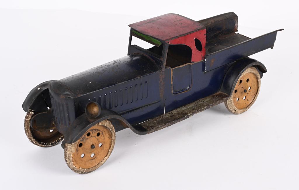 SCHIEBLE 1920'S FRICTION TOY TRUCK: All original condition including white rubber tires. Missing one headlight and tailgate. Should clean to a higher grade. 18", Very Good