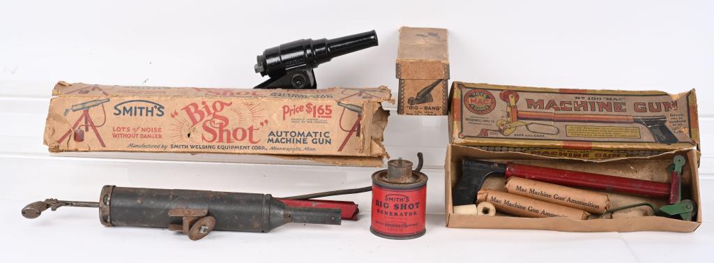 SMITHS BIG SHOT, MAC MACHINE GUN, & MORE: Lot includes Smiths Big Shot Automatic Machine Gun Boxed with Car, MAC Machine Gun with Box, and Big Bang Cannon with Box. All in original condition. Largest 19" Very Good-Excellent