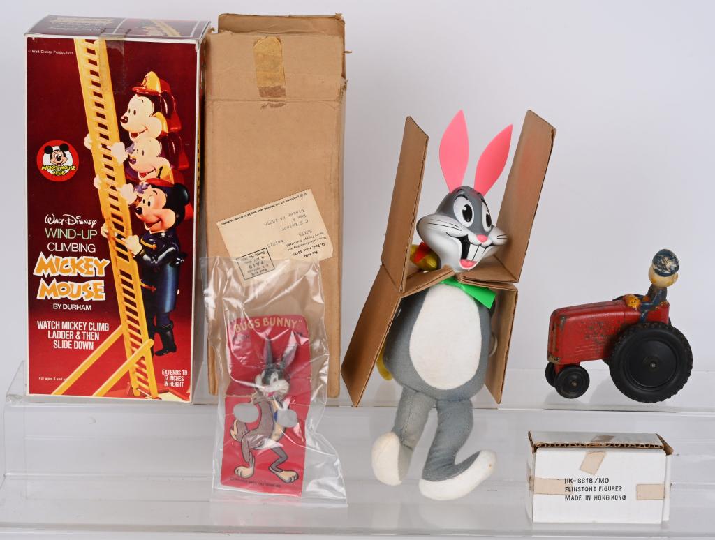 LOT OF VINTAGE CHARACTER TOYS: Includes Climbing Mickey Mouse, Bugs Bunny in Box, Bugs Bunny Lite on Card, Flintstones Figures in Box, and Sun Rubber Donald Duck Tractor. Very Good-Excellent