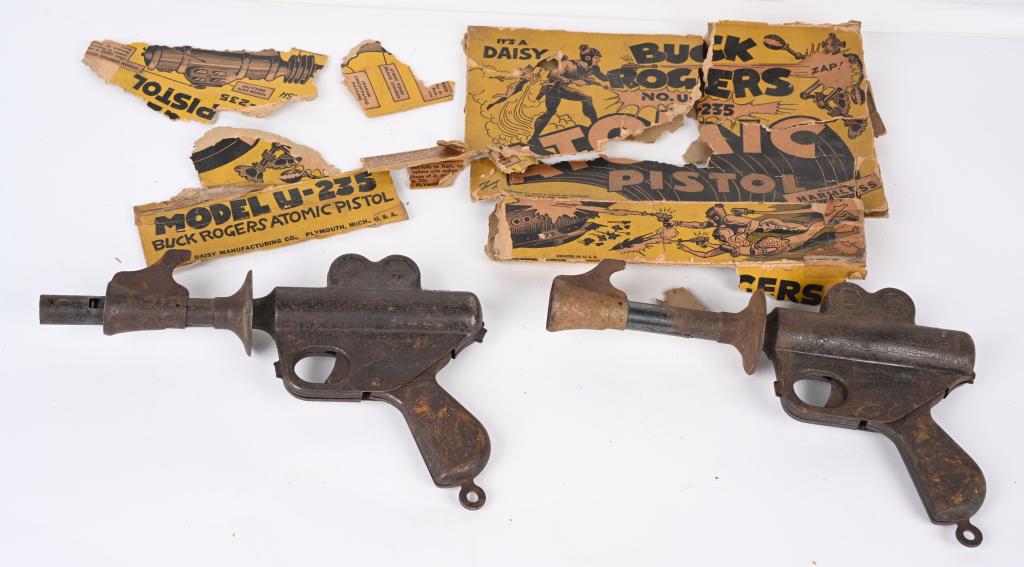 2- DAISY BUCK ROGERS ATOMIC PISTOL w/ BOX: Pair of Buck Rogers Atomic Pistols. Both with corrosion. Comes with partial box. 10" Very Good