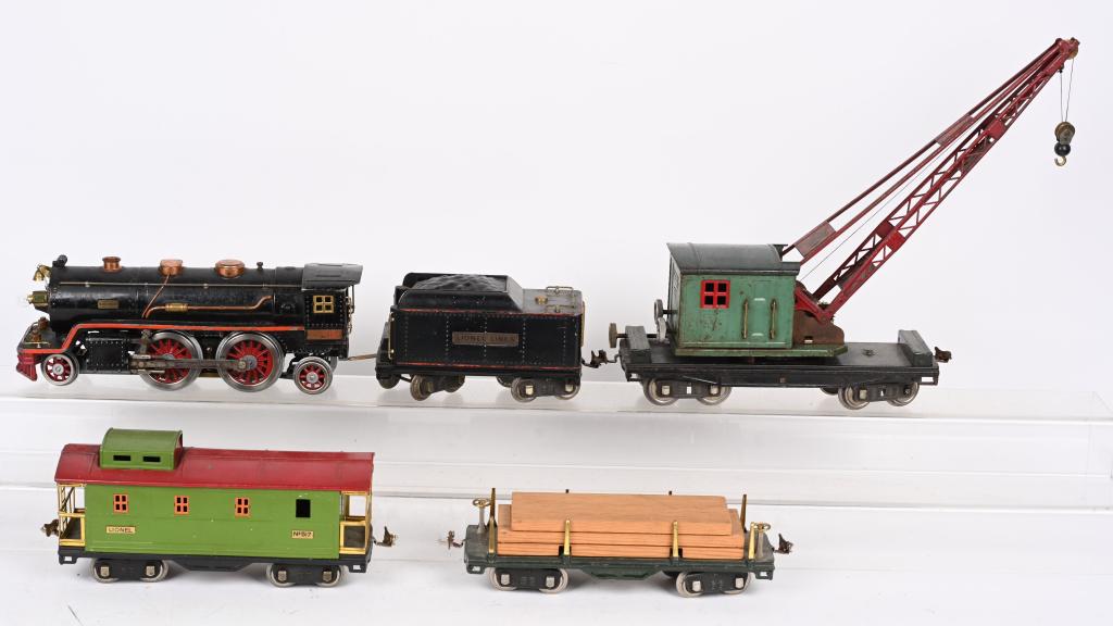 LIONEL PREWAR 390E LOCOMOTIVE w/ FREIGHT CARS: Lionel Prewar Standard Gauge #390E Locomotive and Tender. All original condition with normal play wear. Comes with #219 Crane Car, #511 Flat Car with Lumber, and #517 Caboose. All in original conditio