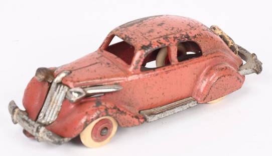 HUBLEY CAST IRON STUDEBAKER SEDAN: Hubley cast iron Studebaker Sedan. Nice original toy with scarce Salmon paint color. All original except for correct replacement tires. No cracks or repairs. 5". Very Good