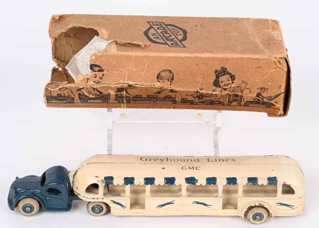 ARCADE CAST IRON 1933 WORLDS FAIR GMC TRAILER BUS: Arcade cast iron Souvenir of A Century of Progresss Chicago 1933 Greyhound Lines Trailer Bus. All original and in great condition. Unusual version with Greyhound Lines GMC script on Trailer. Comes wit