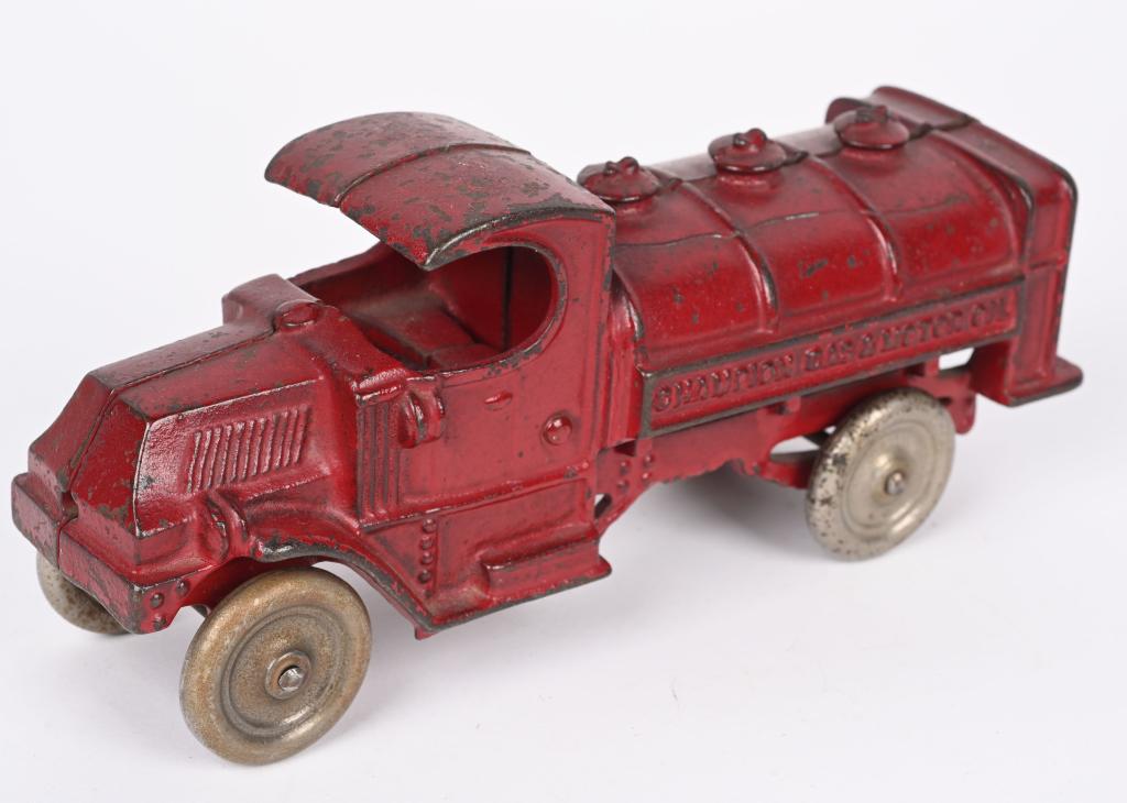 CHAMPION CAST IRON MACK GAS & OIL TANKER TRUCK: Champion cast iron Mack Gas & Oil truck. All original with no cracks or breaks. Has the usual factory casting flaws on tank. Early version with nickel wheels. 8". Very Good-Excellent