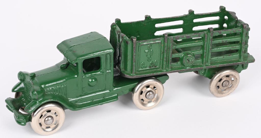 A.C. WILLIAMS CAST IRON TRUCK & STAKE TRAILER: AC Williams Truck and Coast to Coast Stake trailer. All original with bright paint and nickel wheels. No cracks or breaks. 6 3/4" Excellent