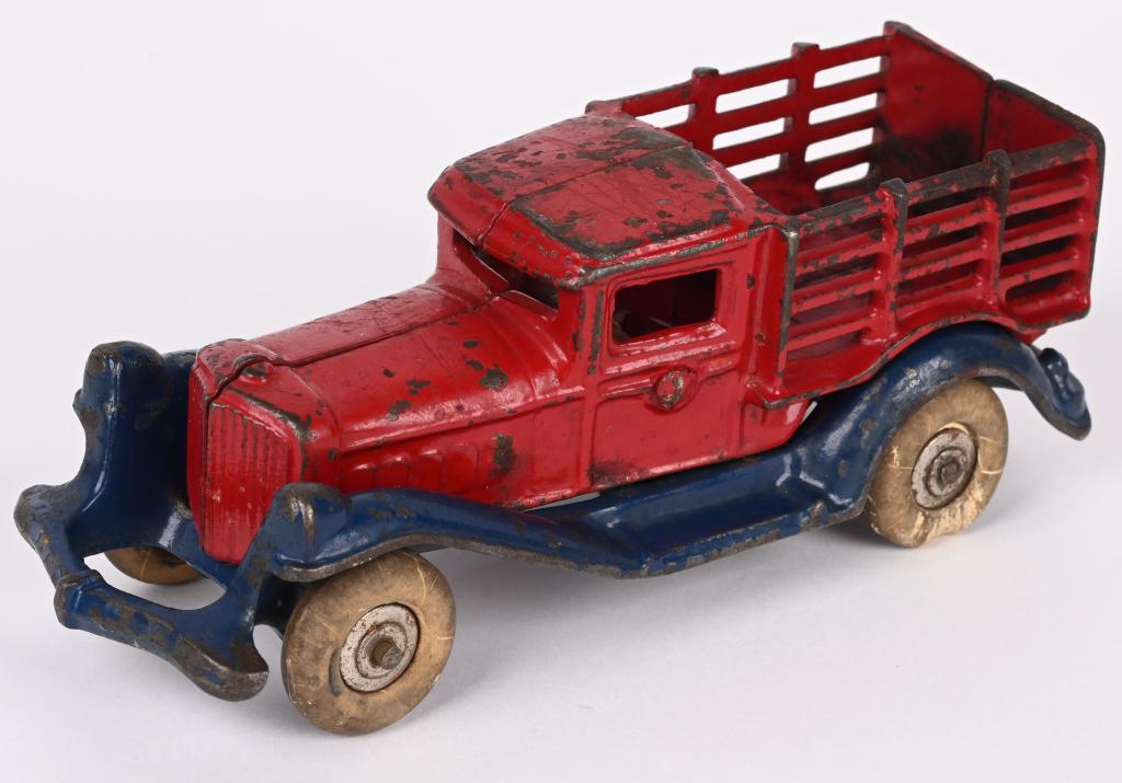 A.C. WILLIAMS CAST IRON LARGE STAKE TRUCK 7": All original large size of the AC Williams take-a-part stake truck. No cracks or repairs. 7", Very Good-Excellent