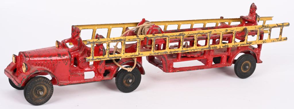 ARCADE CAST IRON FIRE TRUCK & LADDER TRAILER: large Arcade Fire Truck with ladder trailer. Has 3 cast in firemen, 2 metal ladders and hose. No cracks or repairs. 18" Very Good-Excellent