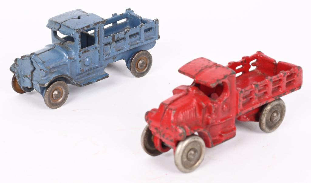 2- CAST IRON STAKE TRUCKS, KILGORE & AC WILLIAMS: The blue truck is made by Kilgore and the reds truck by A.C. Williams. No cracks or repairs. 3 1/2". Excellent