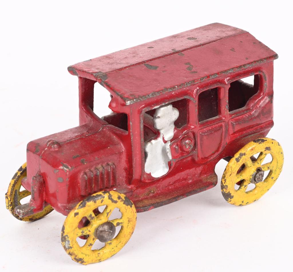 EARLY HUBLEY CAST IRON AUTO w/ CRANK: Scarce early Hubley cast iron auto with cast in driver and crank on the front. Interesting casting has floor underneath. No cracks or repairs. 3 3/4" Excellent
