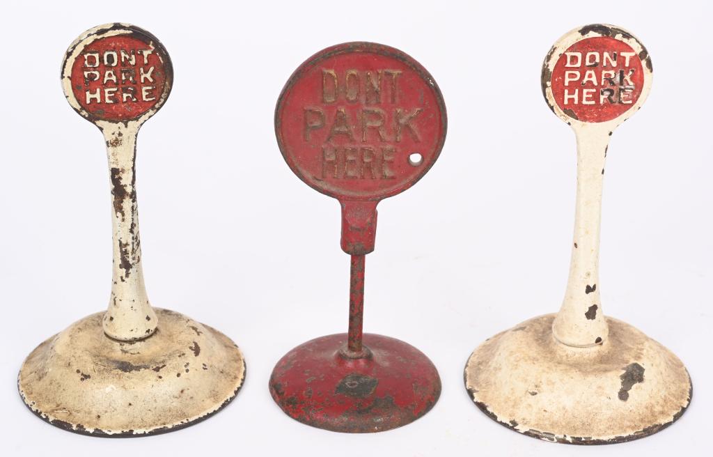 3- ARCADE CAST IRON DON'T PARK HERE SIGNS: Lot includes Don't Park Here Police Dept. sign with Arcade sticker, along with with 2 double sided Don't Park Here signs. Largest is 5". Should clean to a higher grade. Very Good-Excellent