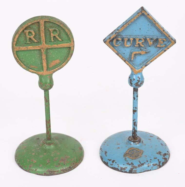 2- ARCADE CAST IRON SIGNS CURVE & RR CROSSING: Lot of 2 all original Arcade toy signs. 4 3/4". Very Good-Excellent
