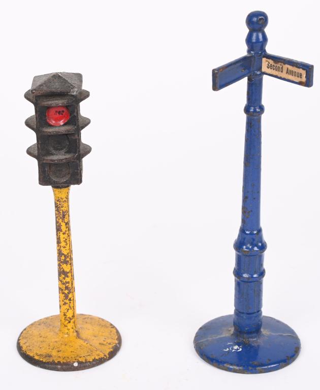 2- KILGORE CAST IRON BILLY BOY TOY ACCESSORIES: Lot includes a cast iron Traffic Light and a Corner Street Pole sign. The Traffic Light has a small corner chip to top. Largest is 6 3/4". Very good