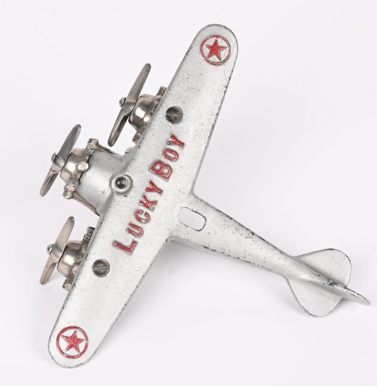 DENT CAST IRON "LUCKY BOY" TRI-MOTOR AIRPLANE: Dent cast iron Lucky Boy Tri-Motor airplane. Book example, pictured on page 120 " Cast iron Automotive Toys, 2000" 7 1/2" WS by 7". Restored, Excellent