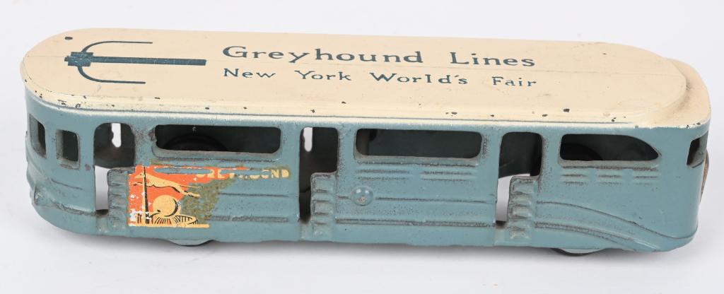 ARCADE CAST IRON GREYHOUND N.Y. WORLD'S FAIR BUS: Smallest size with great original paint and decals. Has Arcade sticker. No cracks or repairs. 6 3/4", Excellent-Near Mint