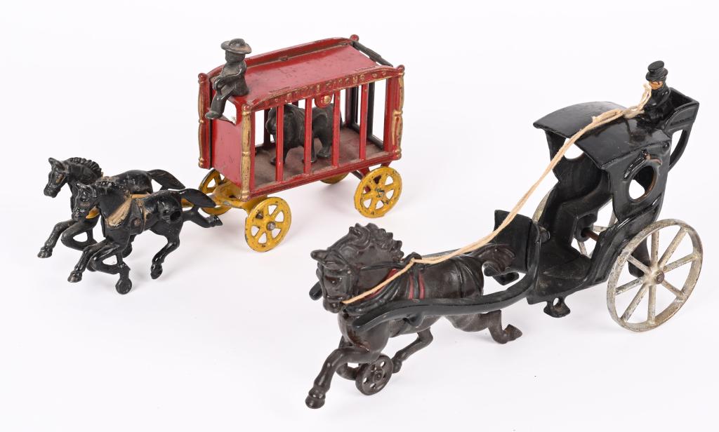 HUBLEY CAST IRON CIRCUS WAGON & HANDSOME CAB: Lot includes small size Hubley Lion Circus Wagon, all original except for rear door, along with a repainted Handsome cab. Largest is 11". Very Good