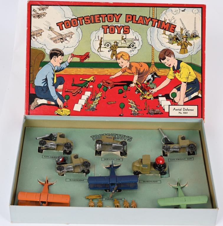 TOOTSIETOY #5061 AERIAL OFFENSE w/ BOX: Tootsietoy #5061 Aerial Offense. All original and complete with 3 Airplanes, 5 Vehicles, and 6 Figures. Boxed 15" Excellent