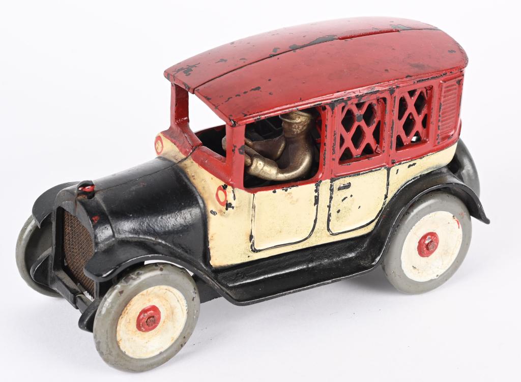ARCADE CAST IRON RED TOP CAB BANK: Arcade cast iron Red Top Cab Bank. Scarce version. Appears to be all original paint. Looks correct under black light. Has a few spots mainly wheels that appear cleaned. Has original Driver and Trap. 8