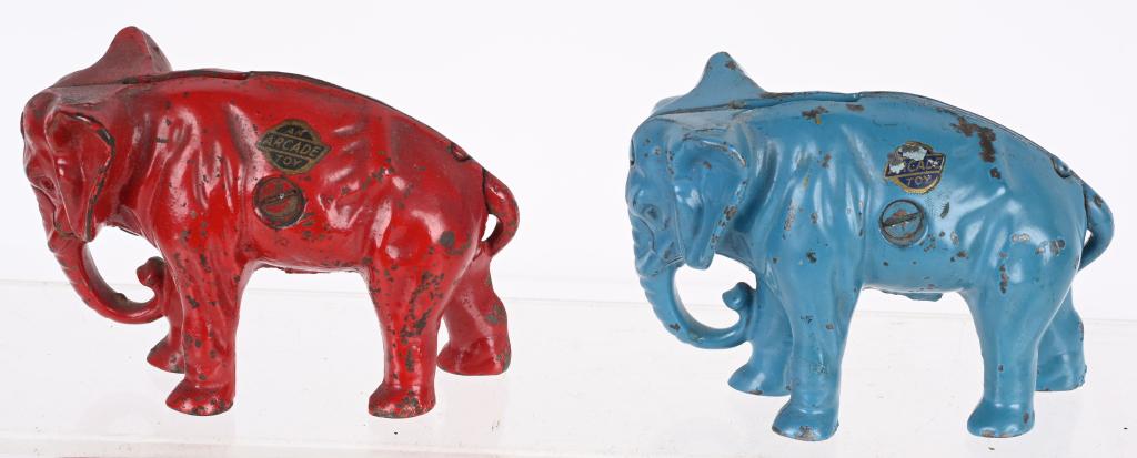2- ARCADE CAST IRON ELEPHANT STILL BANKS: 2 Arcade cast iron Elephant Still Banks. Red and Blue variations. Both with nice paimnt and Arcade sticker. 4" Excellent