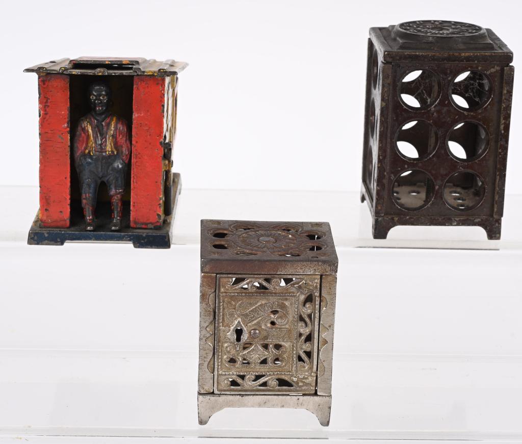 3- CAST IRON BANKS: Includes J&E Stevens Cabin Mechanical Bank original with chip in side, J&E Stevens National Safe, and Arcade Wold Time Bank missing paper clocks. AS-IS