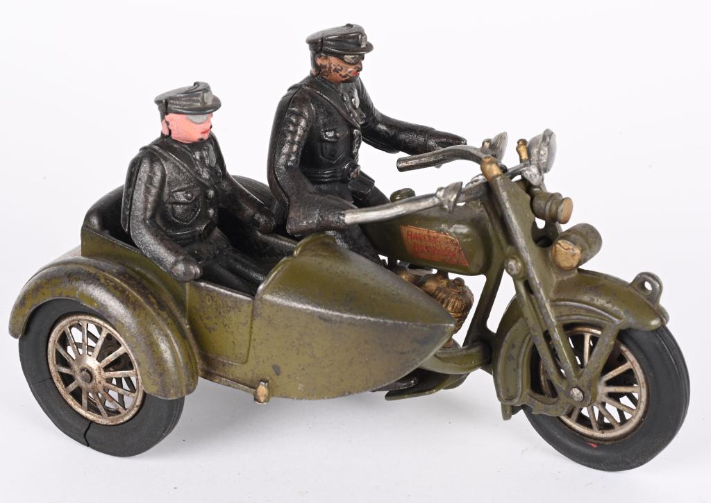 HUBELY CAST IRON HARLEY DAVIDSON MOTORCYCLE: Hubley cast iron Harley Davidson Motorcycle with Sidecar. Very nice original condition. Has nice paint and decals. Comes with both Driver and passenger. A very nice example. 9" Excellent