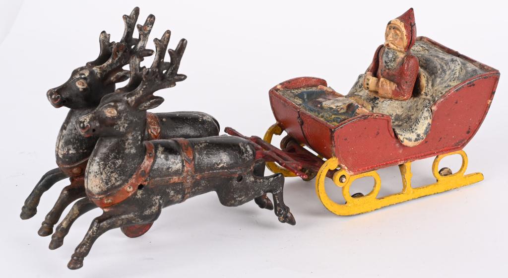 KYSER & REX CAST IRON SANTA IN SLEIGH: RARE Kyser & Rex cast iron Santa in Sleigh pulled by 2 Reindeer. A wonderful toy with great design. This example is all original with very nice paint. The piece was over painted and professionally str
