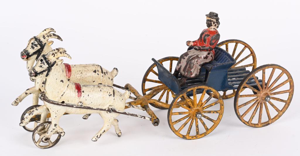 HARRIS TIN WINDUP DOUBLE GOAT CART: Harris tin windup Double Goat Cart. All original and complete with Driver. Still has great paint. 13 1/2" Excellent