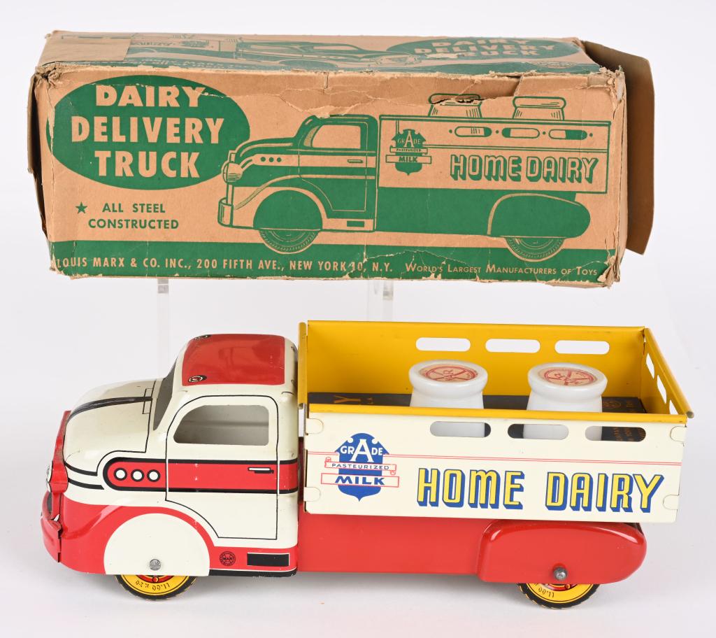 MARX DAIRY DELIVERY TRUCK w/ BOX: Marx Dairy Delivery Truck. All original and looks basically never played with. Still has bed insert and 2 milk bottles. Comes with partial Box. 10" Excellent