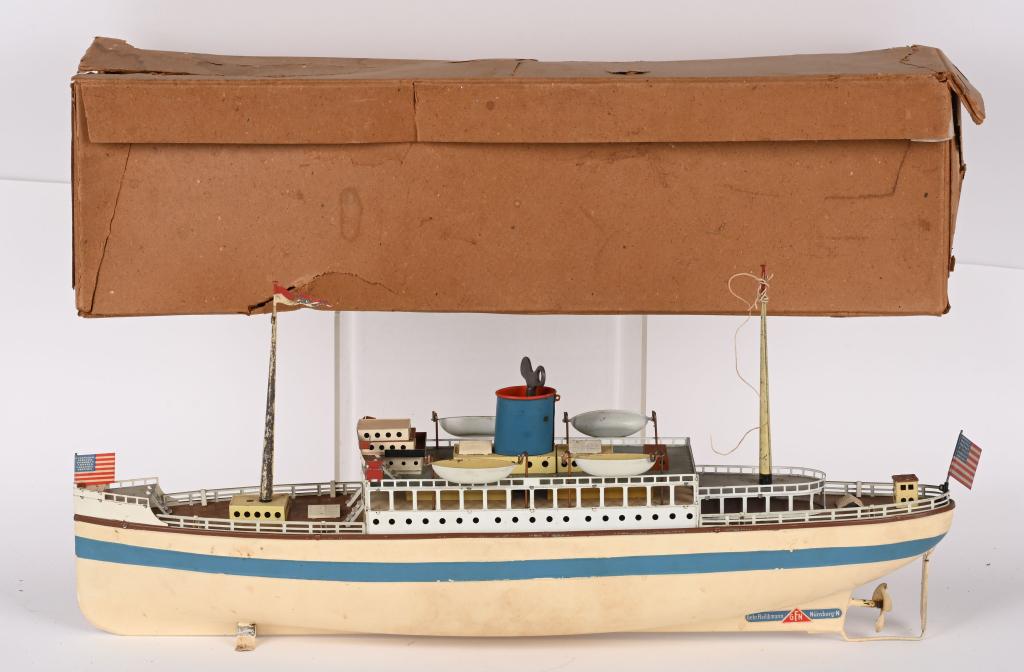 FLEISCHMANN CLOCKWORK OCEAN LINER w/ BOX: Fleischmann clockwork Ocean Liner. All original with wonderful paint and decals. Still has both masts, lifeboats, and flag. Clockwork run swell. A very impressive Toy Boat. Comes with Box. 20" Excelle