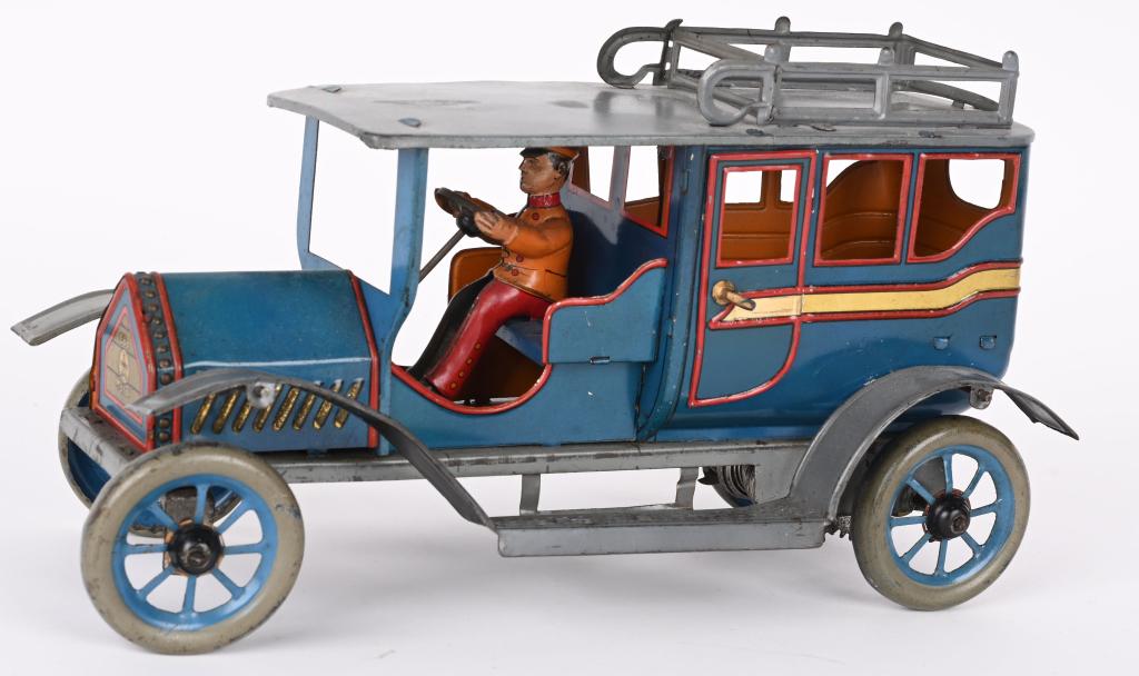 EBERL TIN WINDUP EARLY LIMOUSINE: German tin windup Early Limousine. Great looking car with nice details. Has driver, roof rack, and full running boards. Windup works. Roof appears repainted and one door has replaced tabs. A great loo