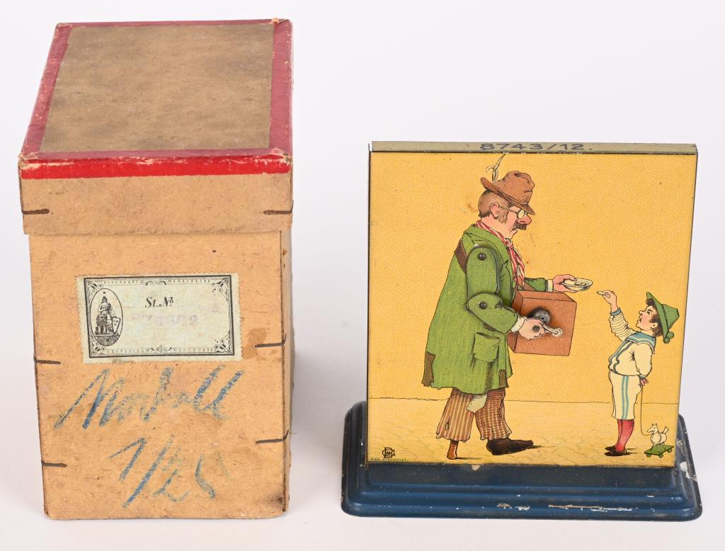 GERMAN ORGAN GRINDER STEAM TOY w/ BOX: German Organ Grinder Steam Toy all original with nice graphics. Has plink plunk sound. Boxed 4 1/2" Excellent